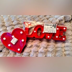 Light up red back with white lights “LOVE” and heart sign combo.